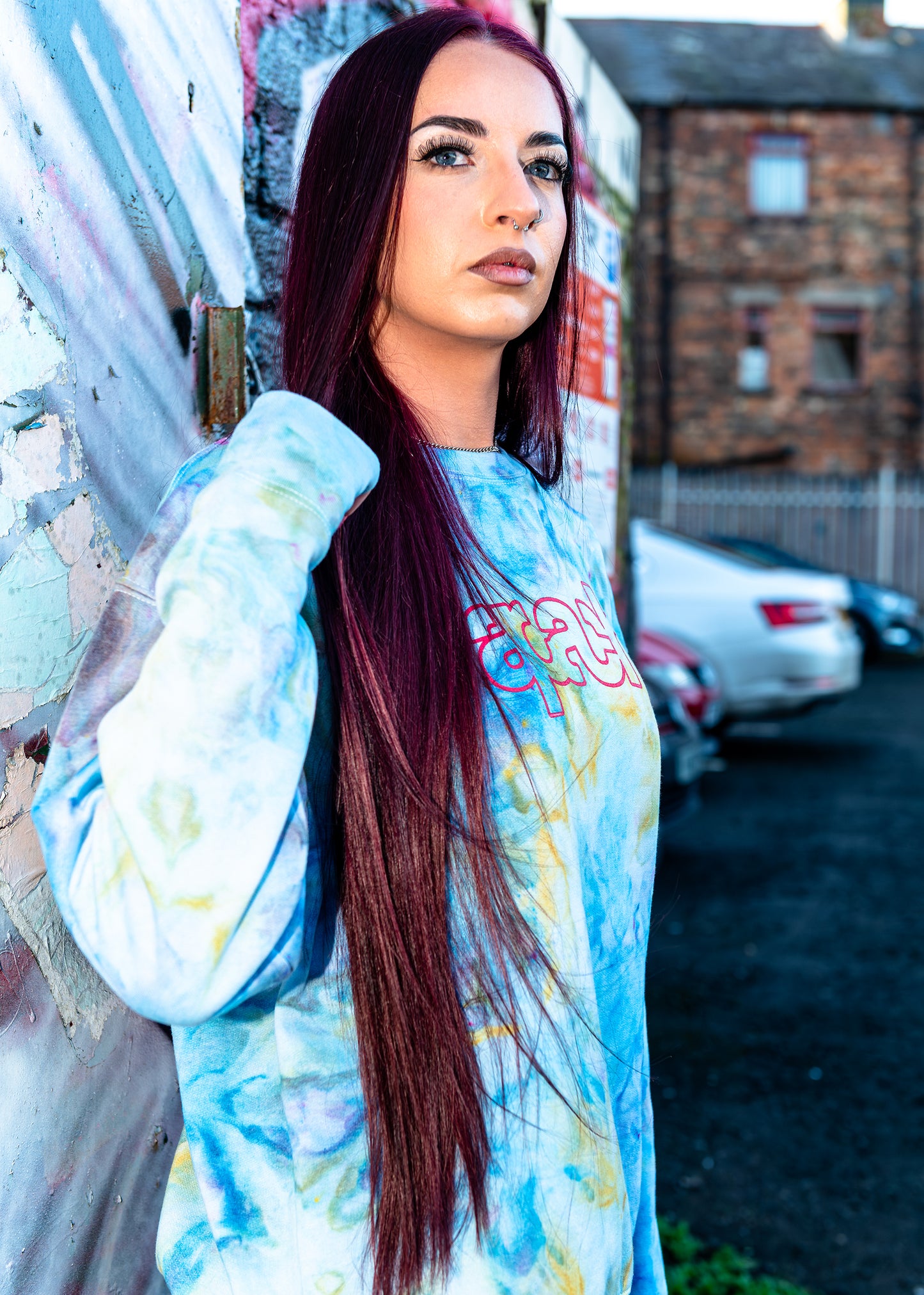Apache Ice Dye Crewneck in pastel blue yellow and green tie-dye pattern with pink Apache logo on chest long sleeve sweatshirt