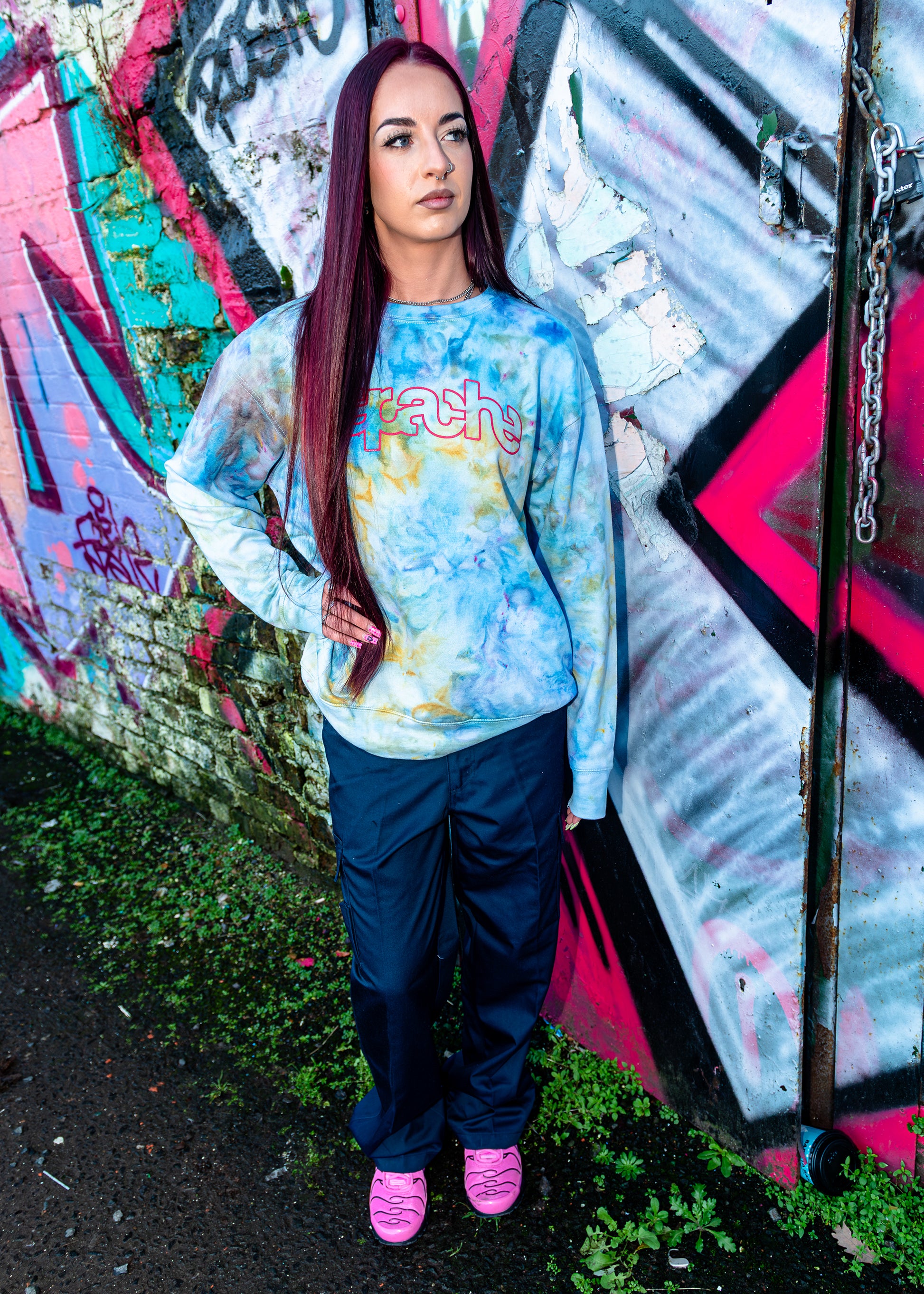 Apache Ice Dye Crewneck in pastel blue and yellow tie-dye pattern with pink Apache logo on chest, oversized fit sweatshirt