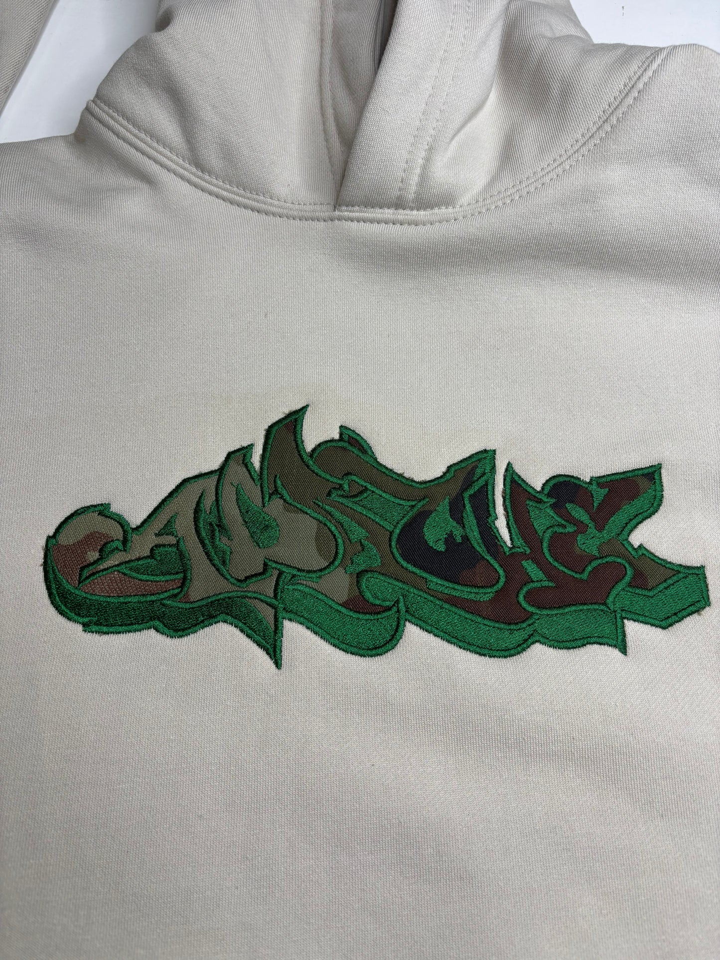 Cream hood w Irish paddy camo and green Apache Appliqué